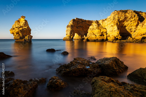 Marinha beach (Praia da Marinha) beaches in Portugal's Algarve region. The rocky Atlantic coast at sunrise, in the golden hour.