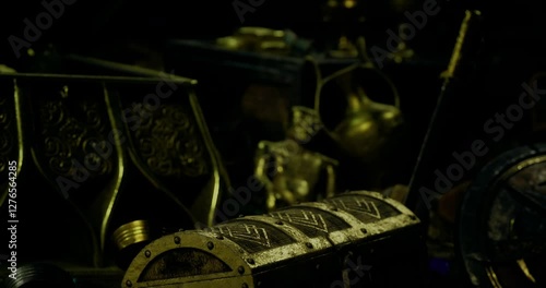 Wallpaper Mural A collection of ancient artifacts is displayed in a dimly lit space. Various items, including a small golden statue and intricately designed containers, are partially visible. Torontodigital.ca