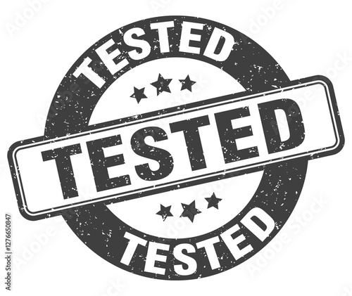 tested stamp. tested label. round grunge sign