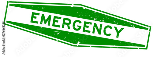 Grunge green emergency word hexagon rubber seal stamp on white background