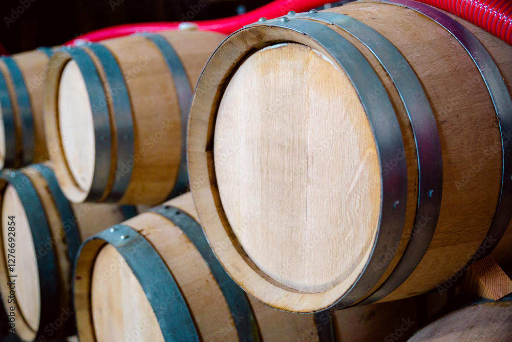 Stack of Wooden Wine Barrels in a Traditional Cellar Setting Stack of Wooden Wine Barrels in a Traditional Cellar Setting