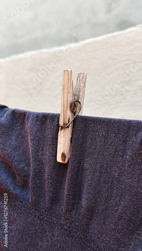 Clothes peg. Clothes on the clothesline, wooden peg