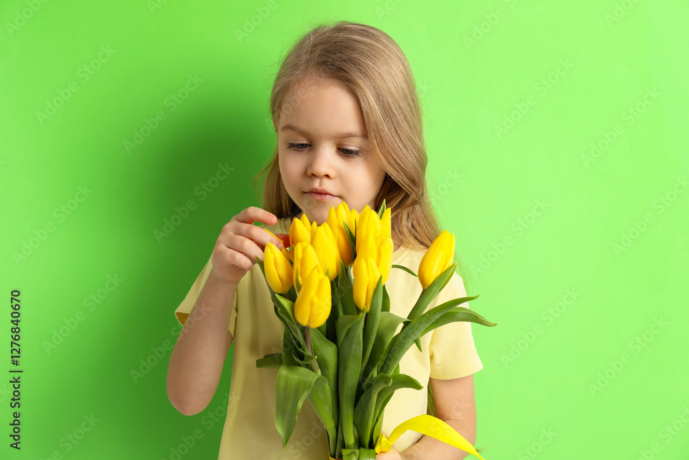 Cute little girl with beautiful yellow tulips on green background. Spring season Cute little girl with beautiful yellow tulips on green background. Spring season
