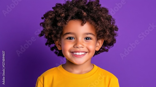 Wallpaper Mural Smiling young boy showing healthy looking directly at the camera with natural afro curls. Isolated on a lavender background. Torontodigital.ca