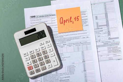 Text April, 15 on orange sticker - last day to file tax return in USA in 2025 photo