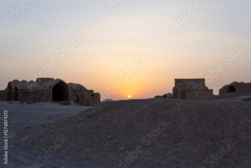 Sunset at ruins of the buildings around the Zoroastrian towers of silence in Yazd, Iran.  photo