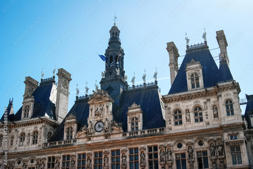 Famous building in the center of Paris the capital of France, City Hall with sculptures on the roof. Photography of architecture in Europe. Famous building in the center of Paris the capital of France, City Hall with sculptures on the roof. Photography of architecture in Europe.
