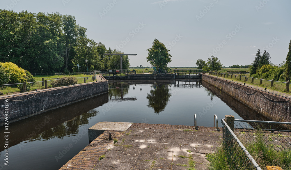 Fototapeta premium Historic Driewegsluis Water Lock in Nijetrijne, Friesland, Netherlands