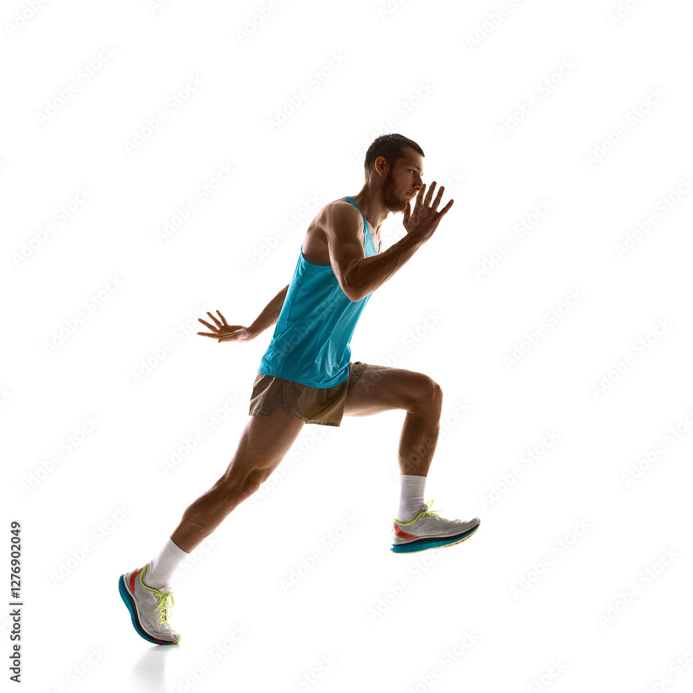 Male athlete sprinting mid-air, powerful stride and focused motion against white studio background. Concept of professional sport, endurance, speed and determination, tournament. Male athlete sprinting mid-air, powerful stride and focused motion against white studio background. Concept of professional sport, endurance, speed and determination, tournament.