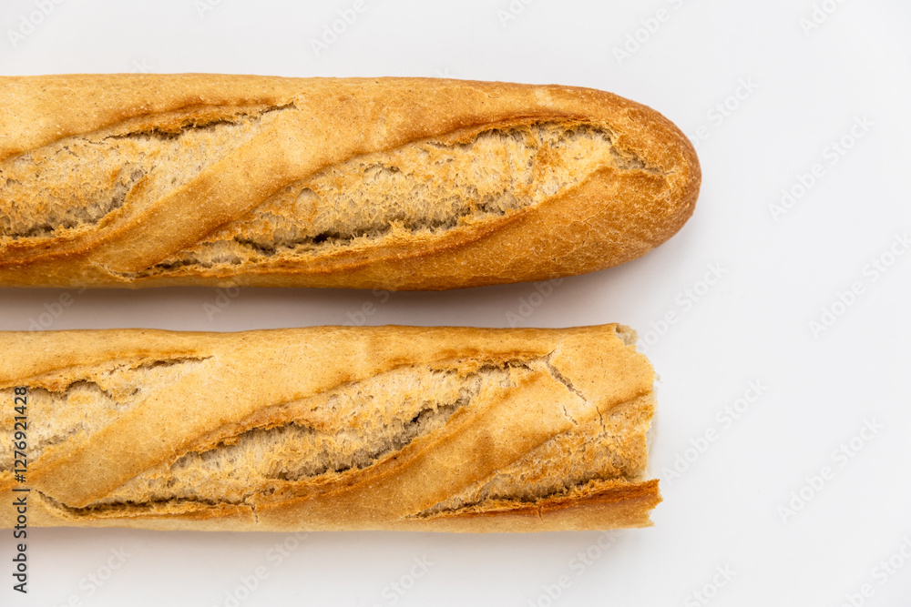 French baguette on a white background. macro shot of fresh bread, organic baked goods French baguette on a white background. macro shot of fresh bread, organic baked goods