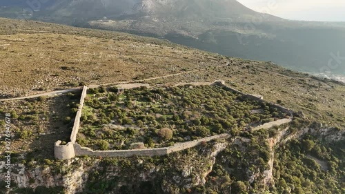 Aerial shot of entire Kelefa Castle near Oitylo sea bay at sunset, Mani, Laconia, Greece. photo