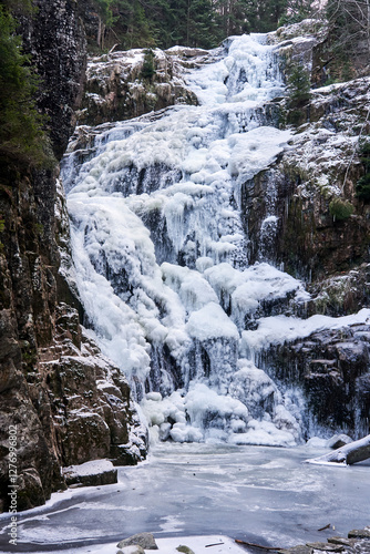 Frozen Kamieńczyk Waterfall in Winter in the Karkonosze Mountains