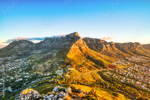 Cape Town Sunset over Camps Bay Beach with Table Mountain and Twelve Apostles in the Background