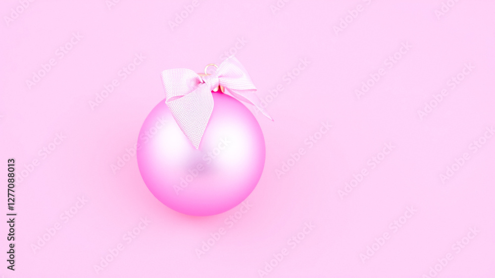 Fototapeta premium pink christmas ornament with white bow