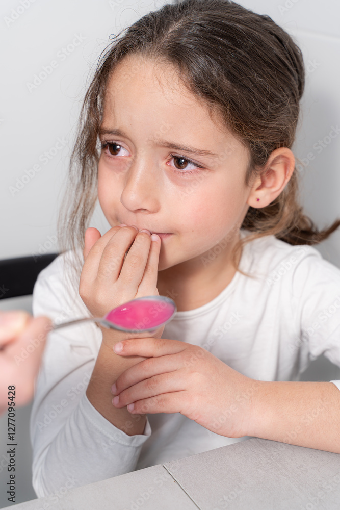Girl afraid to take her medicine