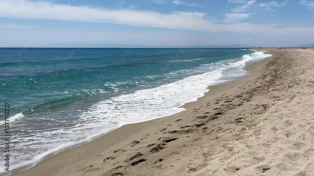 A walk along the beautiful wild sandy beach next to the wonderful sea with waves A walk along the beautiful wild sandy beach next to the wonderful sea with waves