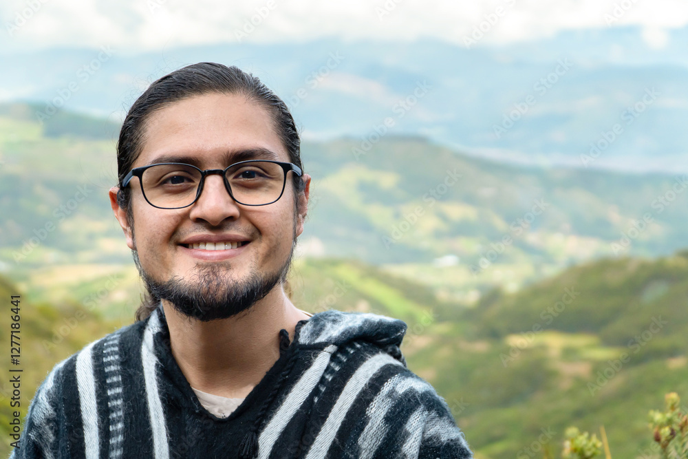 Smiling hispanic man taking a break on a hiking trip. Smiling traveler in the mountains Smiling hispanic man taking a break on a hiking trip. Smiling traveler in the mountains