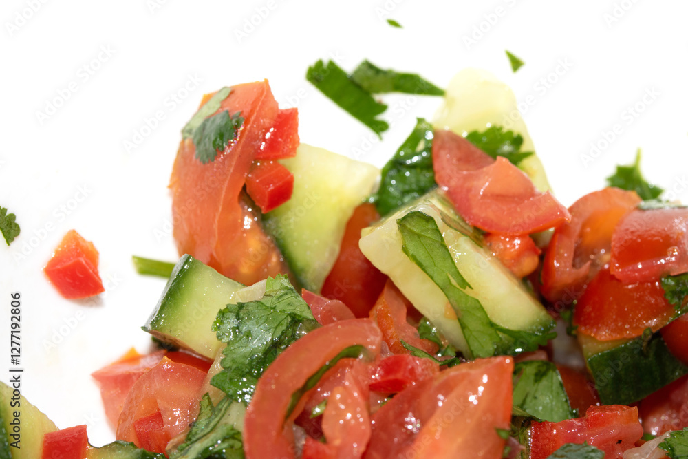A chunky salsa salad of tomatoes and cucumber and herbs close up of salad vegetables A chunky salsa salad of tomatoes and cucumber and herbs close up of salad vegetables