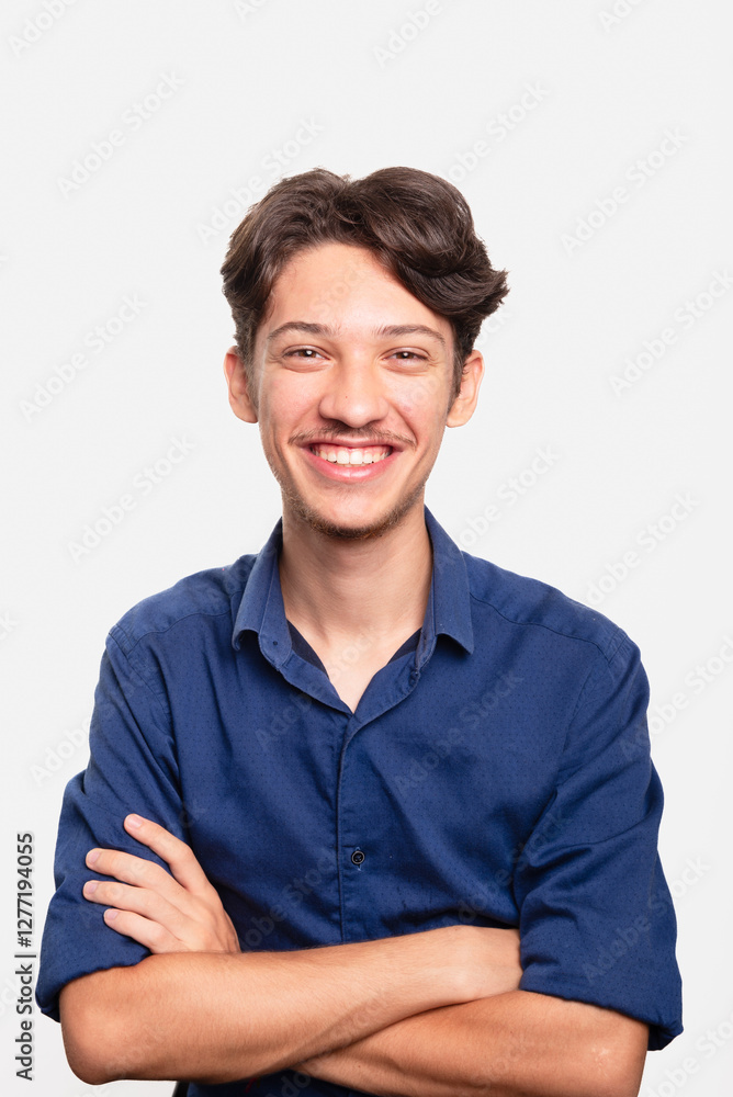 Young handsome student in blue shirt with crossed arms looking at camera. Isolated on white background. Confident person. Young handsome student in blue shirt with crossed arms looking at camera. Isolated on white background. Confident person.