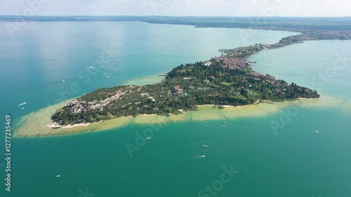 Grotto of Catullus Sirmione Lake of Garda Aerial Drone View. Archaeological site of Grotte di Catullo, Sirmione, Italy early morning aerial view. lake garda. photo