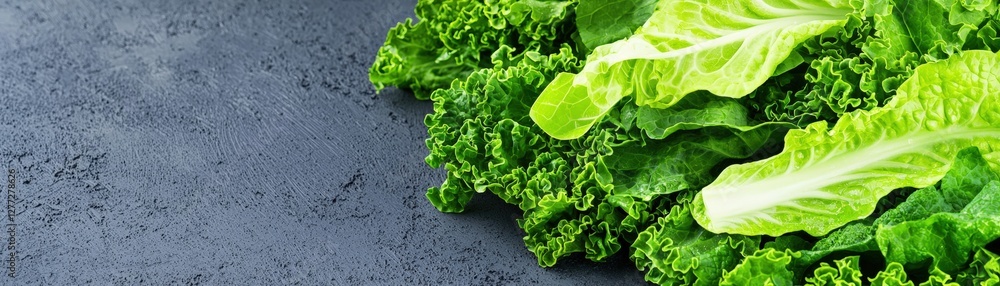 Fototapeta premium Fresh leafy greens on a textured surface.