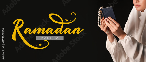 Young Muslim woman with Kor...