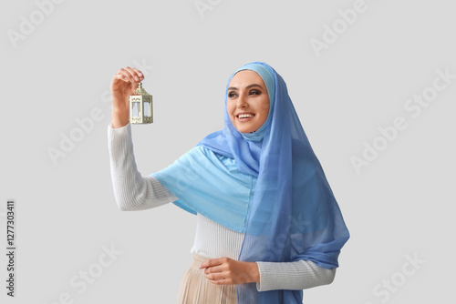 Young Muslim woman with lan...