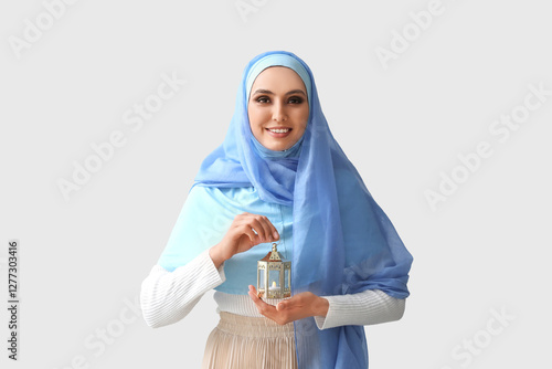 Young Muslim woman with lan...