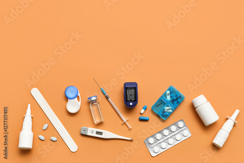 Composition with pulse oximeter, syringe and medicines on beige background photo