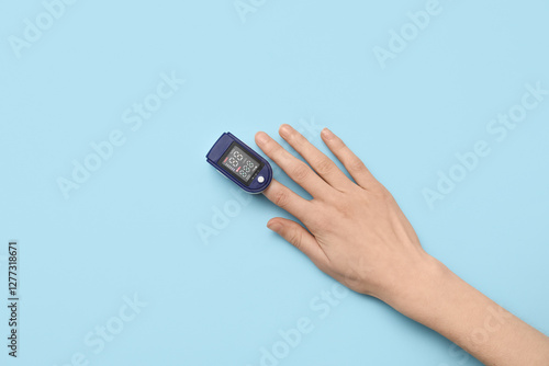 Female hand with pulse oxim...