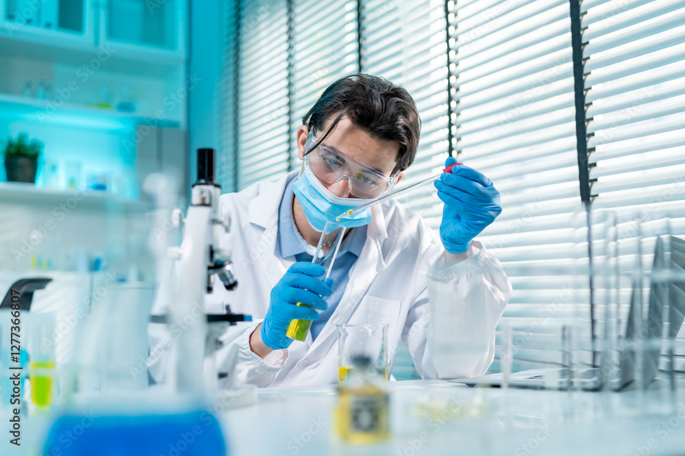 Asian male scientist working in the biotechnology research laboratory. Asian male scientist working in the biotechnology research laboratory.