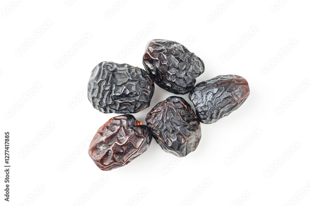 Dates fruit ajwa or kurma ajwa, isolated on white background Dates fruit ajwa or kurma ajwa, isolated on white background