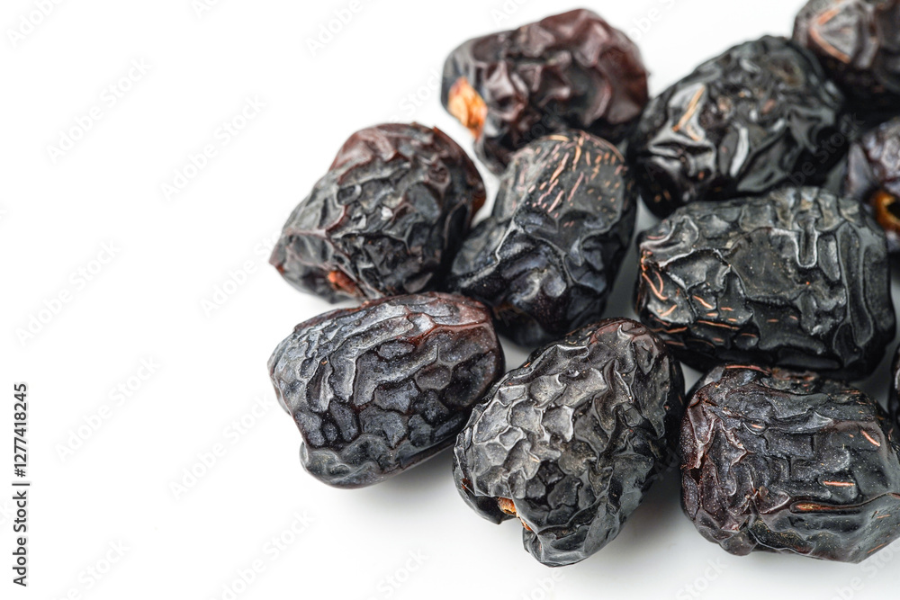 Dates fruit ajwa or kurma ajwa, isolated on white background Dates fruit ajwa or kurma ajwa, isolated on white background