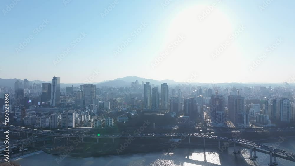 Aerial view of Seoul, South Korea, with the Hangang River winding through the city, video by towering skyscrapers and historical landmarks Aerial view of Seoul, South Korea, with the Hangang River winding through the city, video by towering skyscrapers and historical landmarks