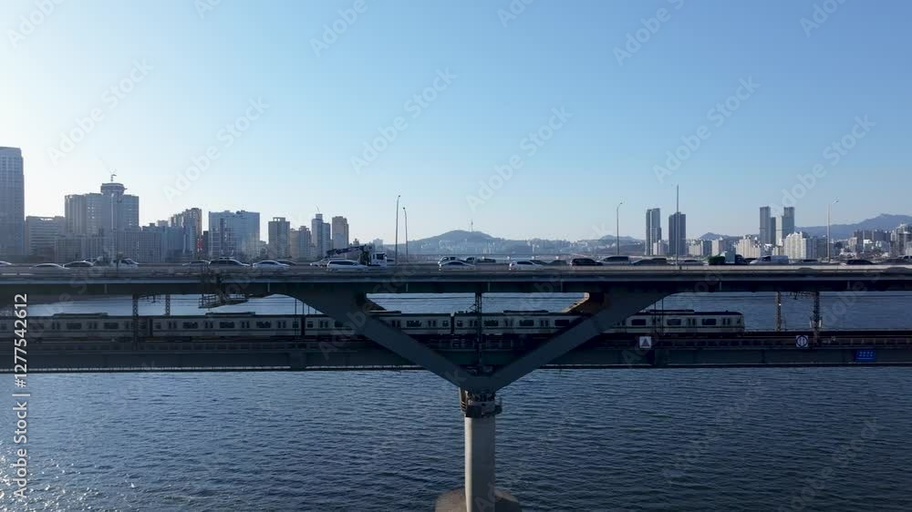 Aerial view of Seoul, South Korea, with the Hangang River winding through the city, video by towering skyscrapers and historical landmarks Aerial view of Seoul, South Korea, with the Hangang River winding through the city, video by towering skyscrapers and historical landmarks