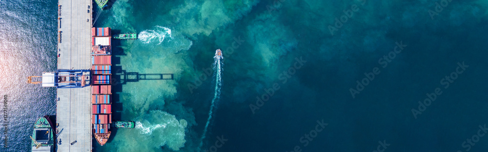 Fototapeta premium Tug boat pulling Cargo container ship go to international yard port. technology freight shipping with smart port. Cargo ship at logistic warehouse.