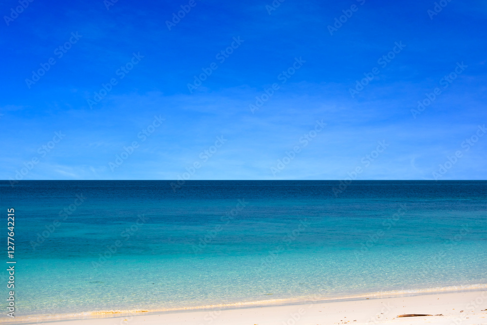 Nature of the beach and sea Summer with sunshine, sandy beaches, clear blue waters sparkling against the blue sky. On an island with good ecology and environment Background for summer vacation Nature of the beach and sea Summer with sunshine, sandy beaches, clear blue waters sparkling against the blue sky. On an island with good ecology and environment Background for summer vacation