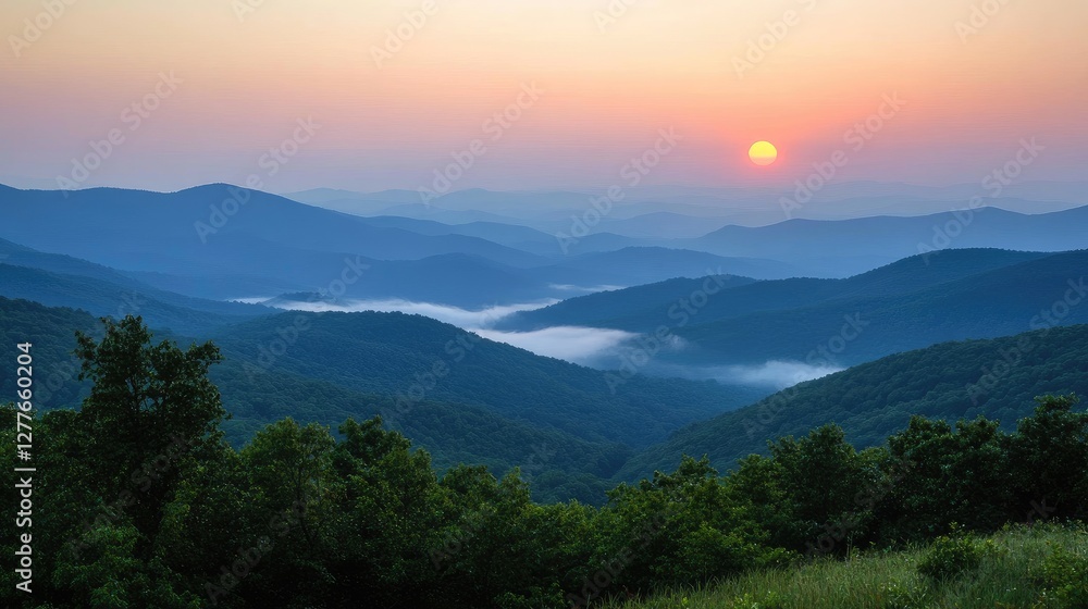 A misty pink sunrise over a mountain landscape. A misty pink sunrise over a mountain landscape.