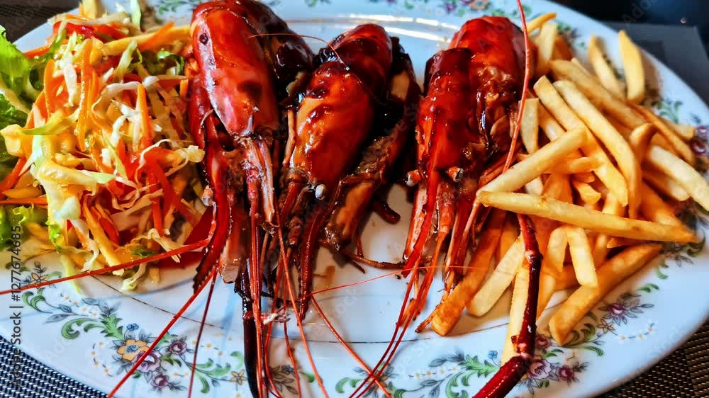 Freshly grilled shrimp with fries and coleslaw served on a plate in Weligama Freshly grilled shrimp with fries and coleslaw served on a plate in Weligama