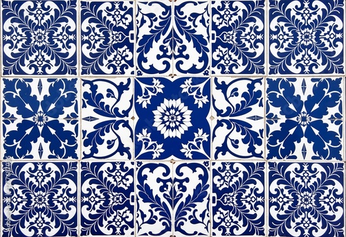 Moroccan Geometric Art: Close-Up of Intricate Blue and White Tile Patterns Featuring Floral and Geometric Designs, Ideal for Artistic and Cultural Projects.


