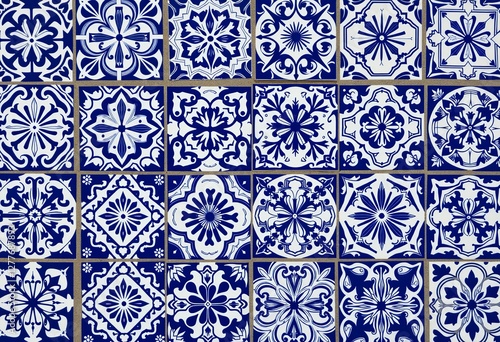 Blue and White Moroccan Tiles: Detailed Close-Up of Intricate Geometric and Floral Patterns, Ideal for Backgrounds, Textures, and Design Inspirations.

