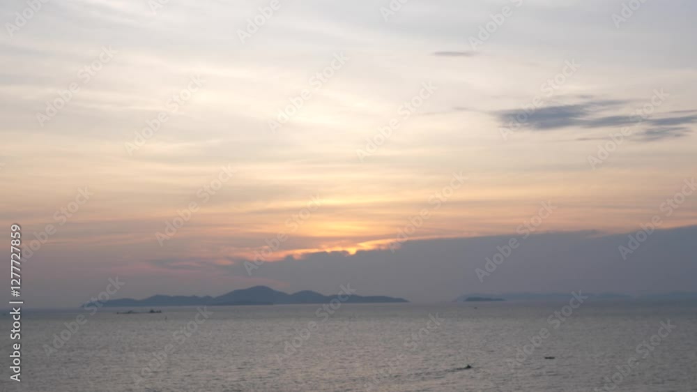 Landscape of orange sky with sunset at ocean in the evening as twilight sky background. Landscape of orange sky with sunset at ocean in the evening as twilight sky background.