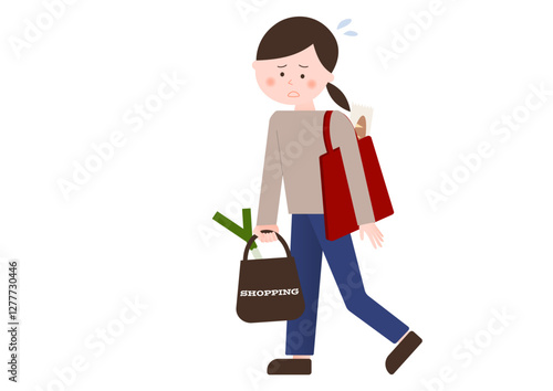 荷物が重くて困る女性