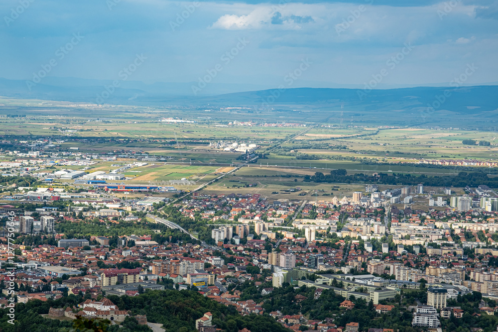 Aerial view of Brasov surrounded by the Carpathian mountains dotted with ski resorts including the ever popular Boiana Brasov. Romania, the Balkans, Eastern Europe Aerial view of Brasov surrounded by the Carpathian mountains dotted with ski resorts including the ever popular Boiana Brasov. Romania, the Balkans, Eastern Europe