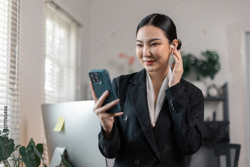 Happy asian woman using mobile phone sitting in workplace. lady holding smartphone talk about business analytics, Copy space.
Happy asian woman using mobile phone sitting in workplace. lady holding smartphone talk about business analytics, Copy space.
