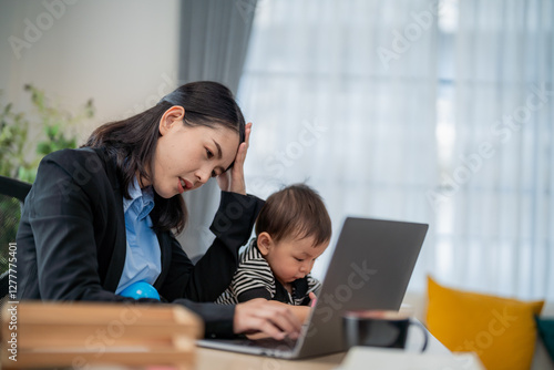 Working mother multitasks with baby while struggling to meet deadlines in a home office setting photo