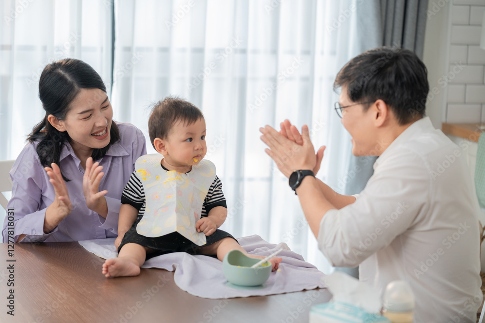 Family bonding during mealtime as parents engage with their baby in a bright dining area Family bonding during mealtime as parents engage with their baby in a bright dining area