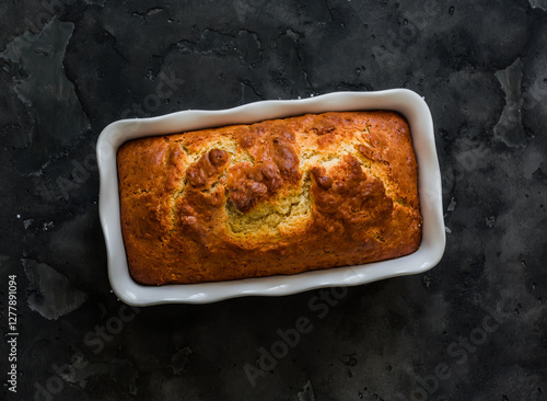 Wallpaper Mural Ricotta lemon pound cake in a baking dish on a dark background top view Torontodigital.ca