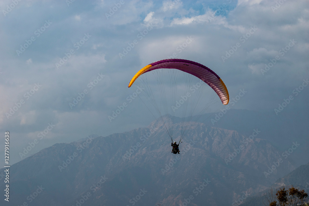 Paragliding over the clouds sunset view at Bir Billing Himachal Pradesh India. Clouds in the sky, Paragliding over the clouds sunset view at Bir Billing Himachal Pradesh India. Clouds in the sky,
