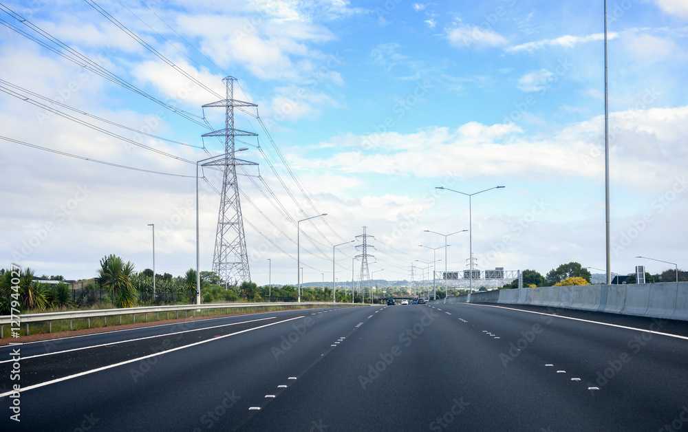 Fototapeta premium Power pylon and power cables along State Highway 1 (SH 1). Auckland.